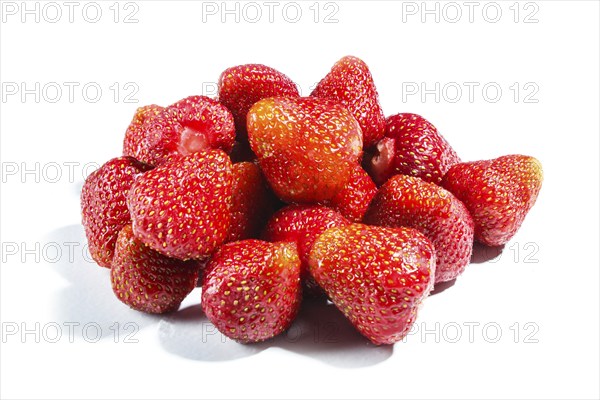 Pile of red strawberry isolated on white background. Closeup