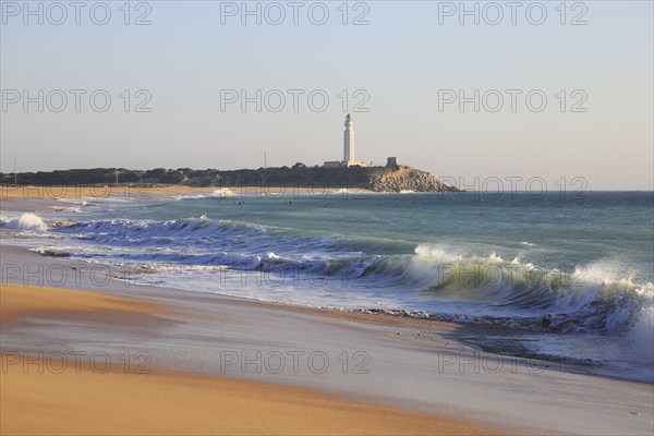 Sandy beach and lighthouse at Cabo de Trafalgar, Cadiz Province, Spain, Europe