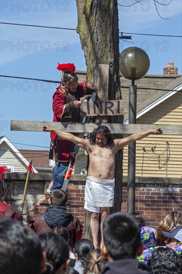 Detroit, Michigan, The Stations of the Cross are portrayed, in Spanish, on Good Friday at the Catholic Basilica of Ste. Anne. Ste. Anne was founded by French colonists in 1701. The church now serves a mostly Mexican-American community