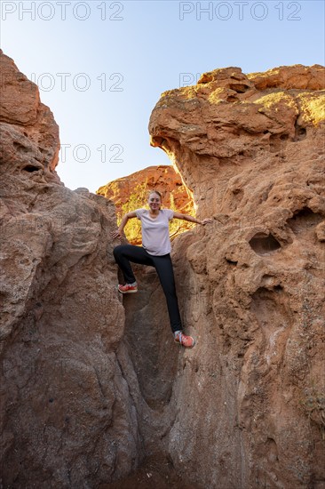 Erosion landscape of red and yellow sandstone, rock formations at sunrise, Skazka Canyon, fairytale gorge, Tosor, Kyrgyzstan, Asia