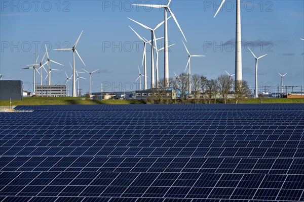 Vopak Solarpark Eemshaven, 19 hectares of solar modules with a capacity of 25 megawatts, around the Vopak tank terminal in the industrial harbour of Eemshaven, wind farm, Groningen, Netherlands