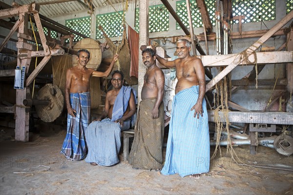 Indian worker in the weaving mill of the Labourers Coir Mats and Mattings Cooperation, coir mat production, Muhamma, Alappuzha, Kerala, India, Asia