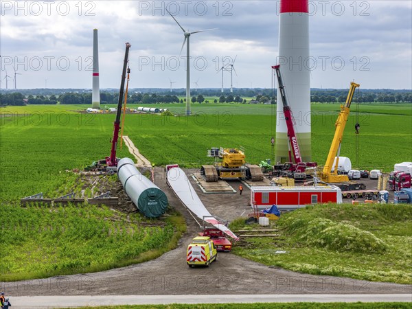 Transport of a 70 metre long rotor blade, construction of a wind power plant in a wind farm near Issum, 9 older wind turbines from the manufacturer Enercon (model series E-58), which have been in operation for over two decades, are being replaced by a total of four Enercon E-160 turbines, under construction, with a total output of 22 megawatts, Lower Rhine, North Rhine-Westphalia, Germany, Europe
