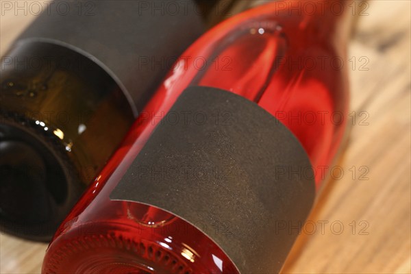 Close-up of two horizontal wine bottles