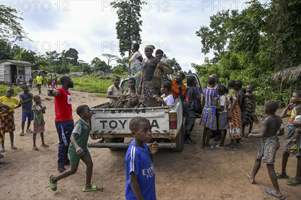 Pygmies of the Baka or BaAka people on a pickup truck, Bayanga, Sangha-Mbaéré Prefecture, Central African Republic, Africa