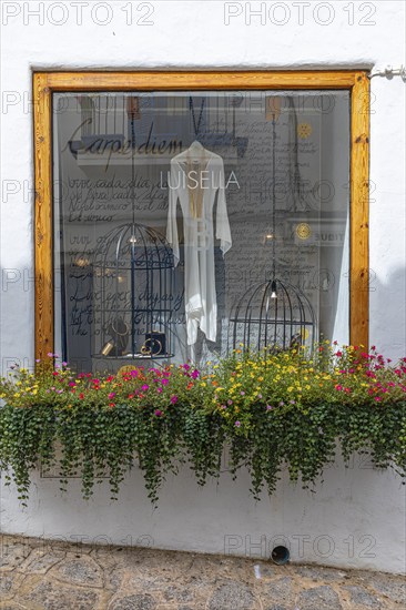 Window of a jewellery shop decorated with flowers in the old town of Eivissa, Ibiza Town, Ibiza, Balearic Islands, Mediterranean Sea, Spain, Europe