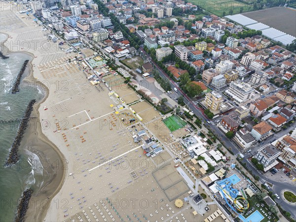 Bathing beach in Rimini. Bathing beach on the Adriatic in bad weather. All deckchairs are free. Drone photo. Rimini, Province of Rimini, Italy, Europe