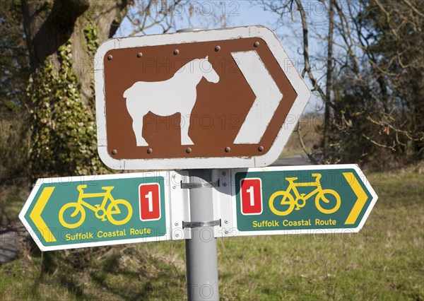 Sign for cycle route and pointing to Suffolk Punch horse tourist attraction of Easton Farm Park, at Hoo, Suffolk, England, United Kingdom, Europe