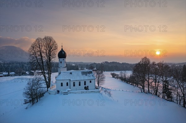 Sunset, Church of the Visitation of the Virgin Mary in winter, Oberbuchen, drone shot, Tölzer Land, Upper Bavaria, Bavaria, Germany, Europe