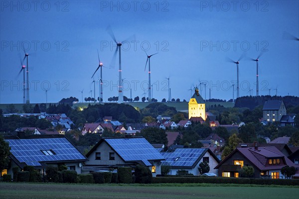 Wind farm above the village of Lichtenau, self-proclaimed energy town, houses with photovoltaic systems on the roofs, Paderborn district, OWL, A North Rhine-Westphalia, Germany, Europe