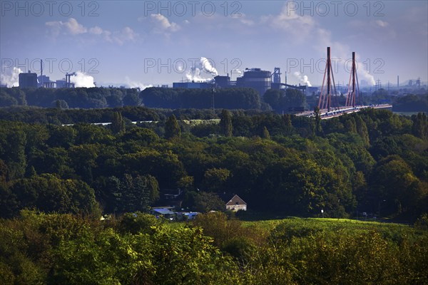 View from the Rheinpreussen spoil tip in Moers to the ThyssenKrupp plant with the bridge of the A 42 motorway in Duisburg, Ruhr area, North Rhine-Westphalia, Germany, Europe