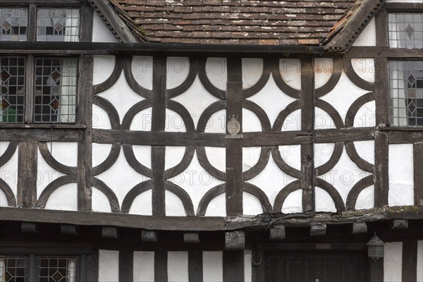 Sixteenth century half timbered architecture details of buildings in High Street, Potterne Wiltshire, England, UK