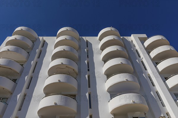 Modern holiday flats with round balconies at the harbour of Santa Eularia, Ibiza, Balearic Islands, Mediterranean Sea, Spain, Europe