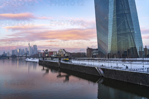 The skyline of Frankfurt am Main, skyscrapers of the banking district, building of the European Central Bank, ECB, wintry morning, Hesse, Germany, Europe