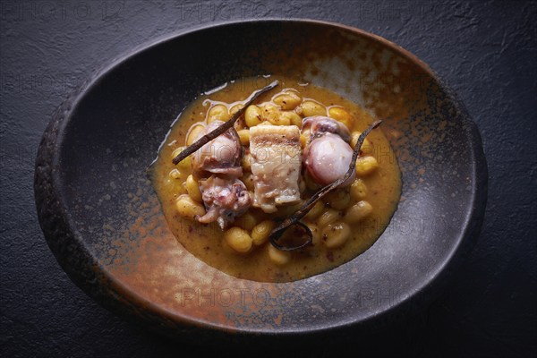 Judias pochas beans with calamari seafood and bacon