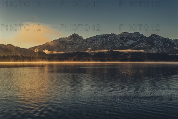 Frosty morning atmosphere during sunrise at Lake Hopfensee in the Allgäu in Bavaria, Germany, Europe
