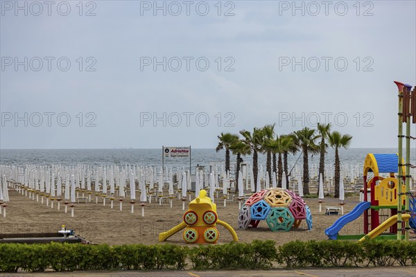 Bagni Lungomare, Chioggia. Bathing beach on the Adriatic in bad weather. All deckchairs are free. Chioggia, Veneto, Italy, Europe