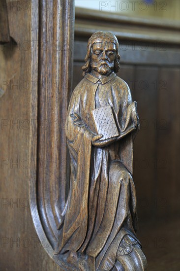Carved wooden pew end figure, Huntingfield church, Suffolk, England, UK