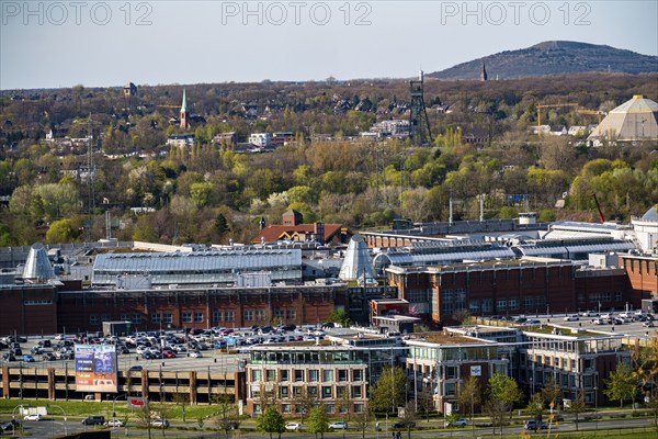 The Westfield Centro shopping centre, Neue Mitte, behind the Olga Park with the headframe of the former Osterfeld colliery, behind the Haniel slagheap, North Rhine-Westphalia, Germany, Europe