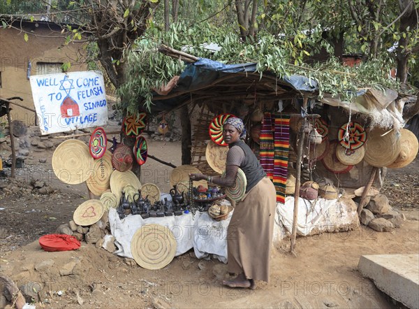 Amhara region, in the Falasha village of Wolleka near Gondar, Gonder, woman selling home-made souvenirs, Ethiopia, Africa