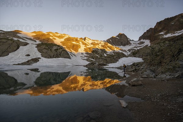 Morning atmosphere at a mountain lake, mountain landscape at sunrise, water reflection in Lac Blanc, Chamonix-Mont-Blanc, Haute-Savoie, France, Europe