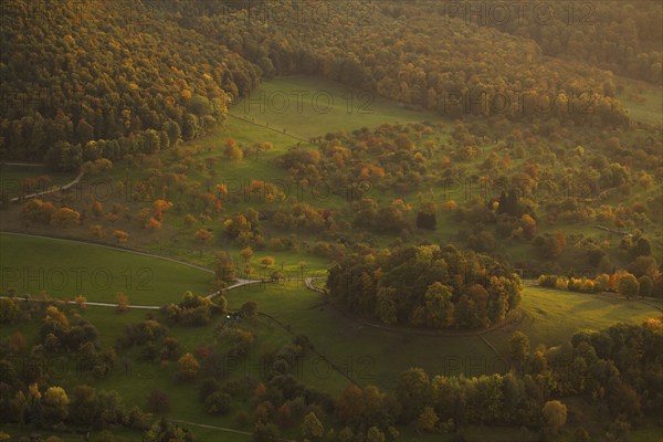 Volcanic embryo Hohbölle near Beuren. Autumnal Swabian Alb at sunset