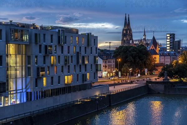 Skyline with Cologne Cathedral, Groß St. Martin Catholic Church, Rheinauenhafen harbour, art'otel cologne on the left, sunset, Rhine, Cologne, North Rhine-Westphalia, Germany, Europe