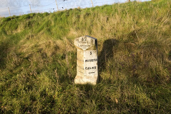 Old milestone road marker on A4 road Beckhampton, Wiltshire, England, UK