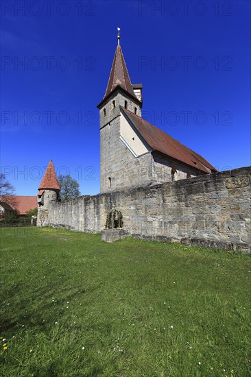 Small Easter fountain in front of the fortified church from the Middle Ages, fortified church, Effeltrich in Franconian Switzerland, district of Forchheim, Upper Franconia, Bavaria, Germany, Europe