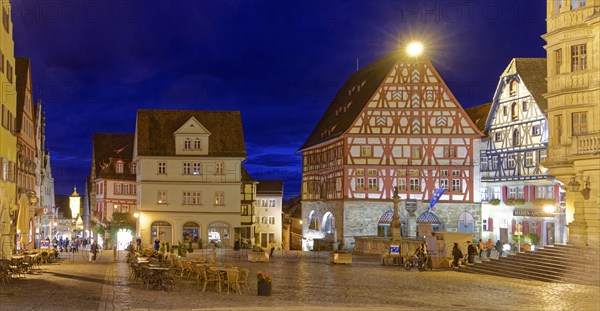 The market square in the old town centre of Rothenburg ob der Tauber, illuminated at night. Rothenburg, Bavaria, Germany, Europe