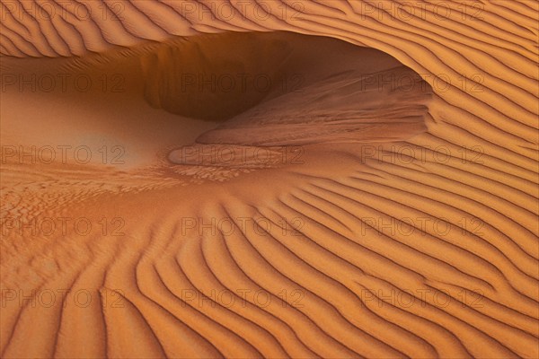 Wind-sculpted sand structure in the Rub al Khali desert, Dhofar province, Arabian Peninsula, Sultanate of Oman