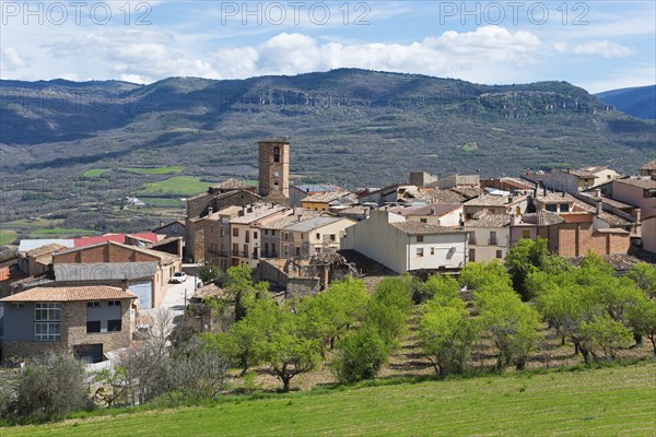 A picturesque village with a clock tower in a mountainous landscape under a clear blue sky, Guardia de Noguera, Lleida province, Catalonia, Spain, Europe