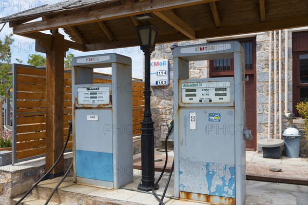 Two old petrol pumps under a wooden roof in a rural setting, Monemvasia, Monemvassia, Monemwassia, Monembasia, Laconia, Peloponnese, Greece, Europe