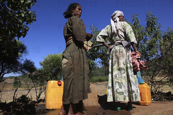 Amhara region, locals fetching water from a well, Ethiopia, Africa