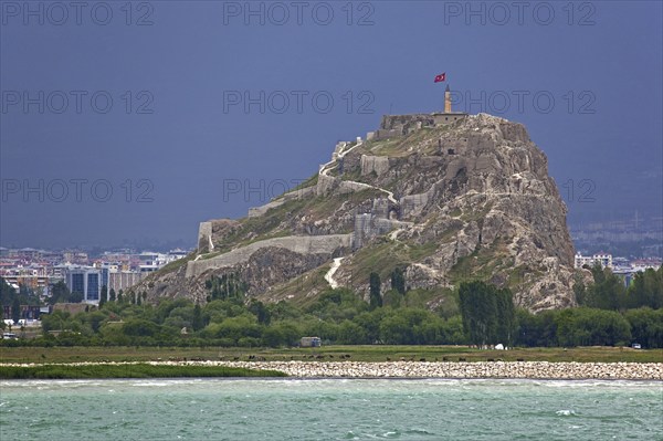 The Fortress of Van, Van Citadel, Van Kalesi on the shores of Lake Van during thunderstorm, Turkey, Asia