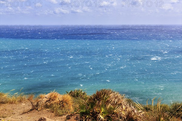 View of turquoise sea, horizon, coastline at La Isleta, sunny weather, typical light mood, minimalist, Almeria, Cabo de Gata, Cabo de Gata-Nijar, Spain, Europe