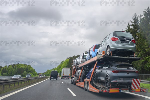 Truck transporter loaded with new cars on the A6 motorway, Bavaria, Germany, Europe