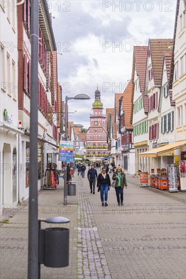 A lively pedestrian zone with half-timbered houses and people strolling along the street, Kirchheim Teck, Germany, Europe