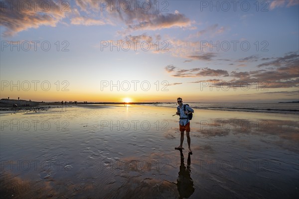 Evening mood, man at low tide on the beach, Marino Ballena National Park, Puntarenas Province, Osa, Costa Rica, Central America