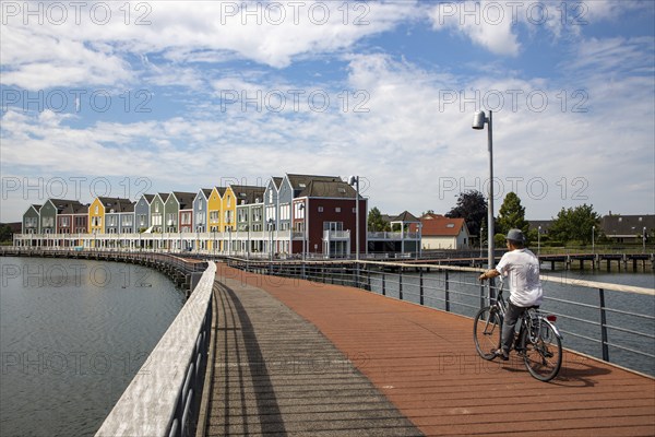 Small town of Houten near Utrecht, bicycles have priority in the town of 50, 000 inhabitants, generous cycle paths, many leisure areas, water areas, living by the water