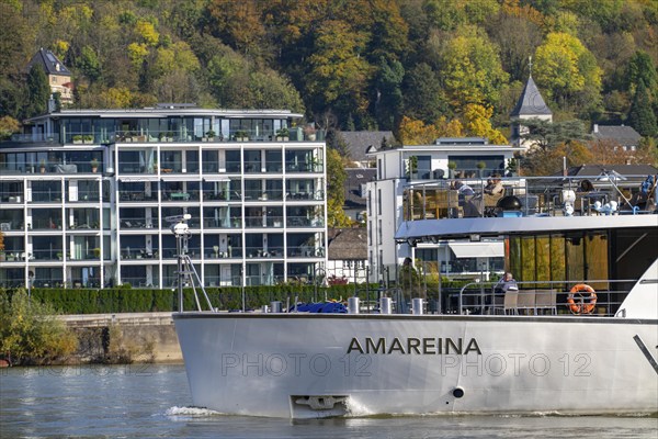 Residential buildings, modern residential complex directly on the Rhine, below the Drachenfels, Siebengebirge, Bad Honnef Rhöndorf, Rhine promenade, river cruise ship Amareina on the Rhine, North Rhine-Westphalia, Germany, Europe