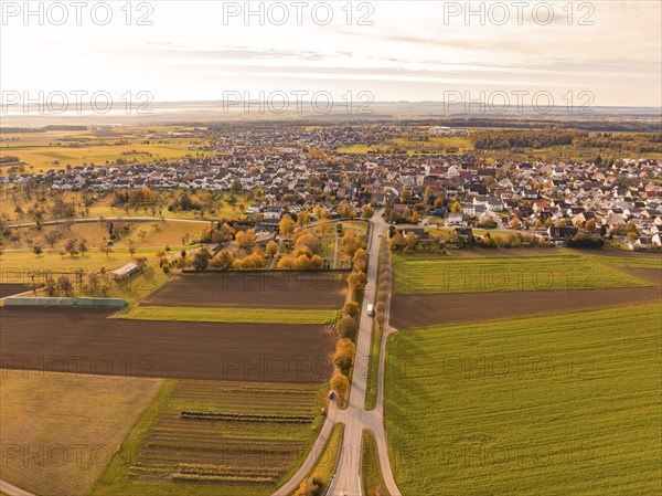 View of a small town surrounded by extensive fields in autumn tones, Jettingen, Black Forest, Germany, Europe