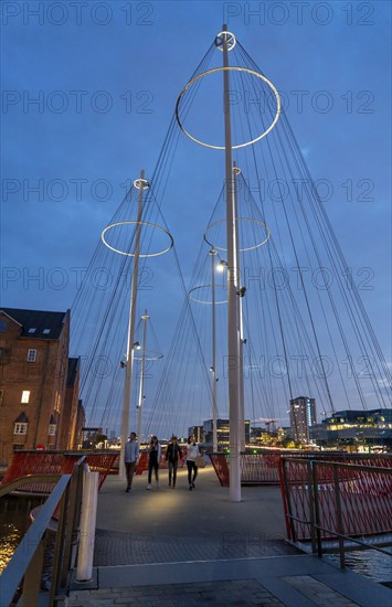 Cyclists on the Cirkelbroen cycle and pedestrian bridge, over the harbour, in the Christianshavens district, Copenhagen is considered the cycling capital of the world, 45 % of the population travel by bike, Denmark, Europe