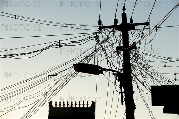 High-voltage power lines, tangle of cables, temple gopura or temple tower, Rameswaram or Rameshwaram, Pamban Island, Tamil Nadu, India, Asia