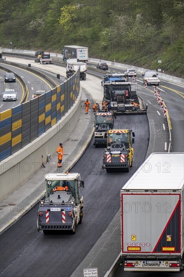 Motorway construction site on the A52 in Essen Basic refurbishment of the motorway, new noise barriers, sewerage system, new road surface, asphalting work, North Rhine-Westphalia, Germany, Europe