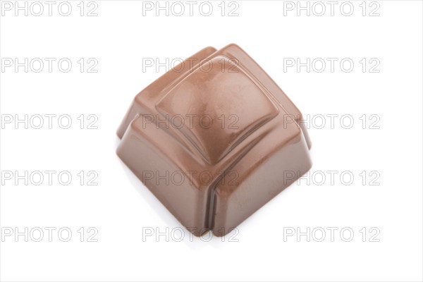 Single chocolate candy isolated on white background. side view, close up
