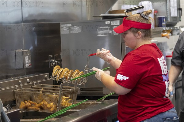 Romulus, Michigan USA, 27 August 2024, Workers filled fast food orders as Sheetz opened its first Michigan gas station and convenience store. The family-owned company operates more than 700 stores, mostly in eastern states