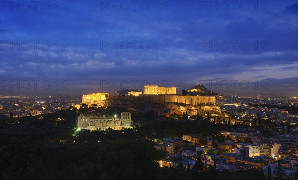 Famous greek tourist landmark, the iconic Parthenon Temple at the Acropolis of Athens as seen from Philopappos Hill in the evening blue hour, Athens, Greece, Europe