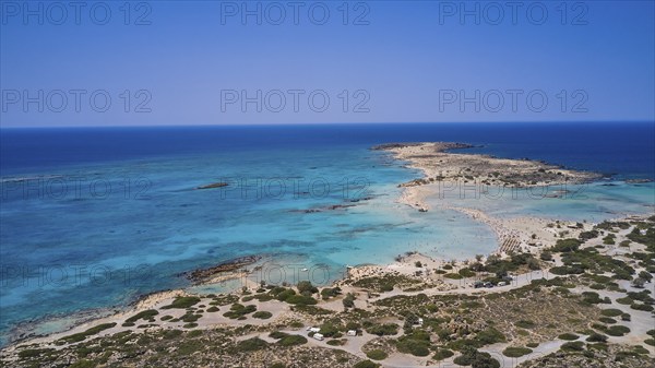 Overtourism, tourists on the beach, parasols, A sandy coast with turquoise sea, a popular nature holiday destination, Elafonissi, lagoon, south-western tip of Crete, Crete, Greek islands, Greece, Europe