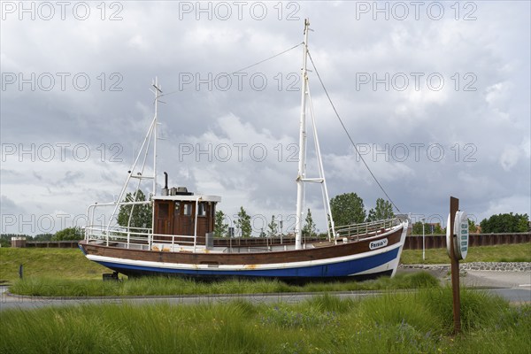 Fishing boat in front of the Ocean wave adventure pool, Norddeich, East Frisia, Lower Saxony, Germany, Europe